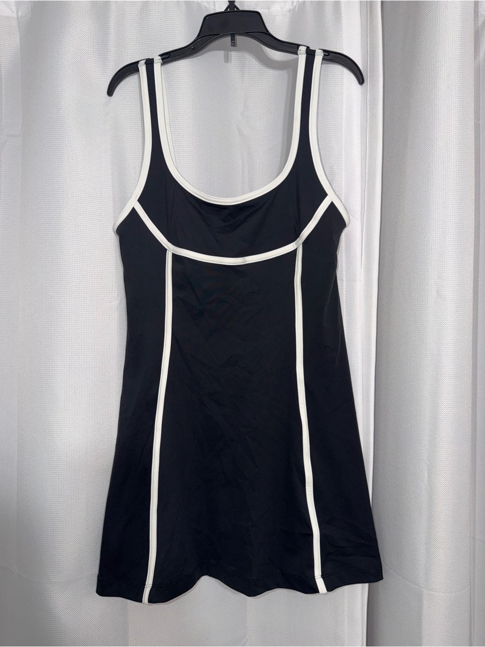 Daily Practice- Black workout dress with white trim and connected spandex shorts